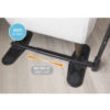 Stander Couch Cane beside a couch, showing the adjustable handle and organizer pouch for convenient support.