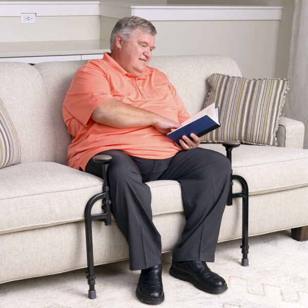EZ Stand-N-Go Heavy Duty with dual handles and adjustable frame, providing stable support for safe transitions from couches and chairs.