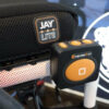 Empulse R90 Power Assist Device attached to a wheelchair, providing lightweight mobility support with a range of up to 9 miles.