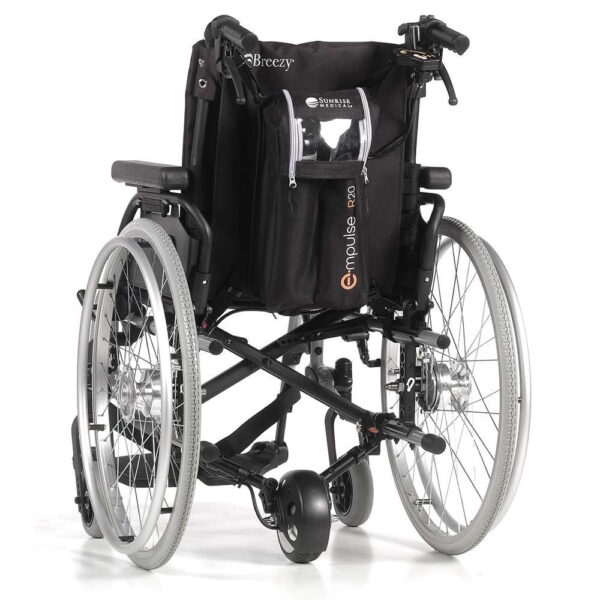 Empulse R90 Power Assist Device attached to a wheelchair, providing lightweight mobility support with a range of up to 9 miles.