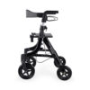 Essentials Compact Rollator with shopping bag, backrest, 6” wheels, cane holder, and cup holder in a lightweight, foldable design.