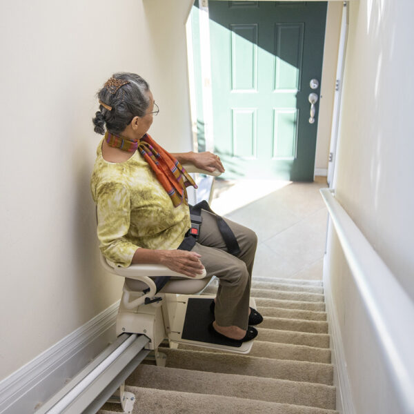 Harmar Pinnacle Stair Lift installed on a staircase, showing a compact and smooth operation for enhanced home mobility.