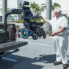 Harmar-AL425HDpermwharhighna04122017-Hamar15_lpr Harmar AL425 Hoist Lift installed in a van cargo area, showcasing powered lifting and rotation for easy mobility device transport.