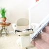 Harmar-SL300FR_Installed_17_0208_Bottom_lpr Harmar Pinnacle Stair Lift installed on a staircase, showing a compact and smooth operation for enhanced home mobility.