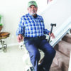 Harmar-SL300_Lifestyle_17_0282_BillBottomStairs_lpr Harmar Pinnacle Stair Lift installed on a staircase, showing a compact and smooth operation for enhanced home mobility.