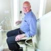 Harmar-SL300_Lifestyle_17_0417_Walt_lpr Harmar Pinnacle Stair Lift installed on a staircase, showing a compact and smooth operation for enhanced home mobility.