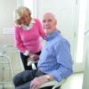 Harmar-SL300_Lifestyle_17_0445_Couple_lpr Harmar Pinnacle Stair Lift installed on a staircase, showing a compact and smooth operation for enhanced home mobility.