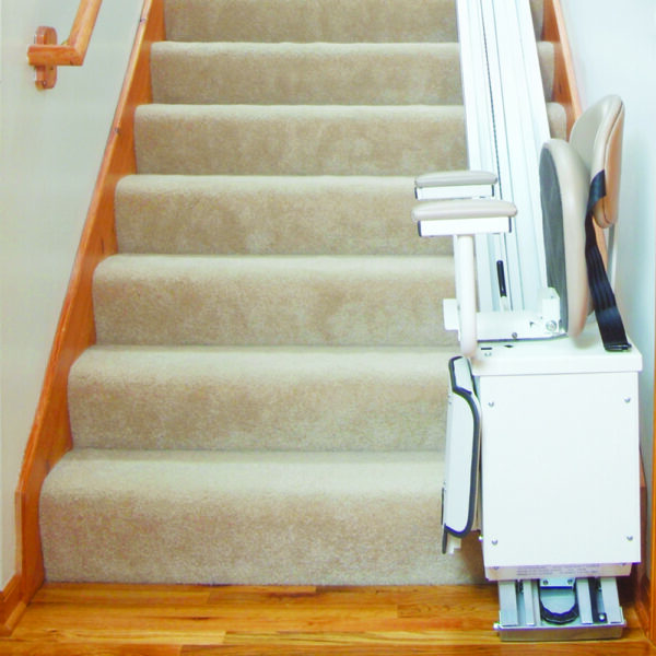 Harmar SL350AC Stairlift installed indoors, showing a wide padded seat, adjustable footrest, and sturdy aluminum track.