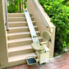 SL350OD_Installed_2020_2036_Outside Harmar Summit Outdoor Stairlift installed on an outdoor staircase, featuring durable aluminum track and weatherproof vinyl seating.