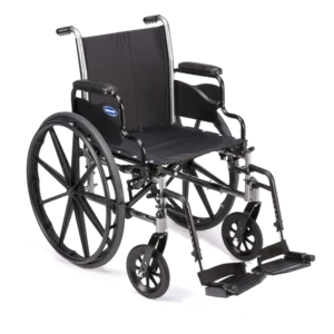 Invacare Tracer SX5 wheelchair with carbon steel frame, padded flip-back armrests, and dual-axle for adjustable hemi-height.