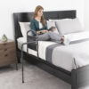 Mobility Bed Rail 5850-new-05 Stander Mobility Bed Rail with pivoting support handle, securely installed on a bed for safe transitions and fall protection.