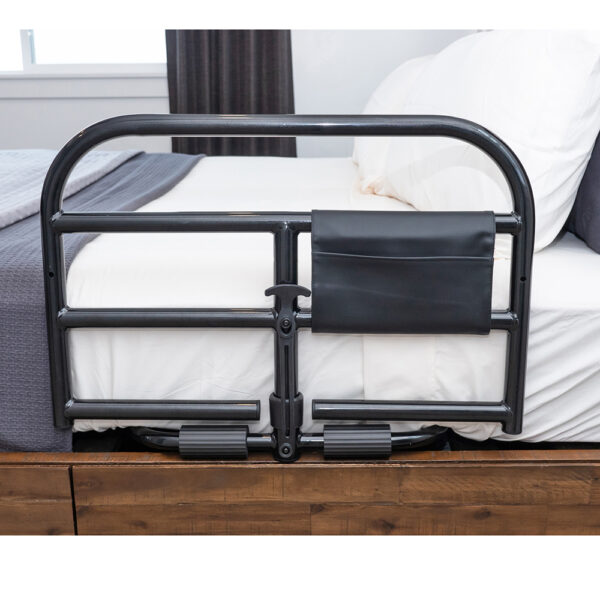 Stander Prime Safety Bed Rail with pivoting design, installed on a bed for extended bedside protection and easy access.