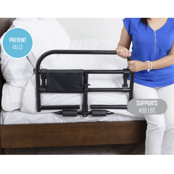 Stander Prime Safety Bed Rail with pivoting design, installed on a bed for extended bedside protection and easy access.