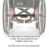 Empulse R90 Power Assist Device attached to a wheelchair, providing lightweight mobility support with a range of up to 9 miles.