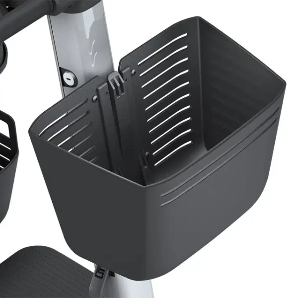 Front Basket attached to WHILL Model Ri tiller, spacious and detachable for carrying groceries and personal items.