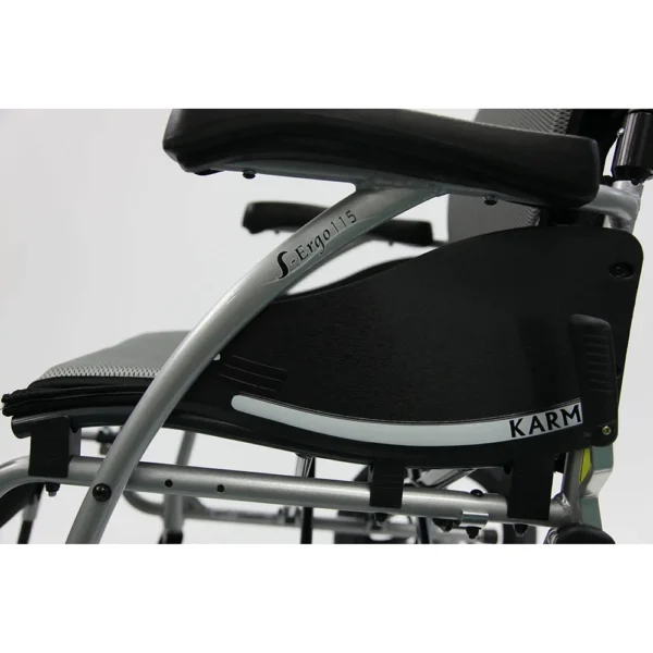 Lightweight S-Ergo 115 Transport Wheelchair with S-shaped ergonomic seat, foldable aluminum frame, and anti-bacterial upholstery.