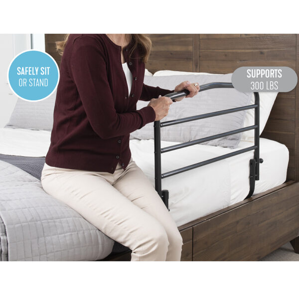 Stander 30” Safety Bed Rail attached to a bed, showing extended length and folding feature for added safety and convenience.