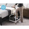 Stander Step with non-slip surface and rubber feet for stability, shown in use by a high bed.