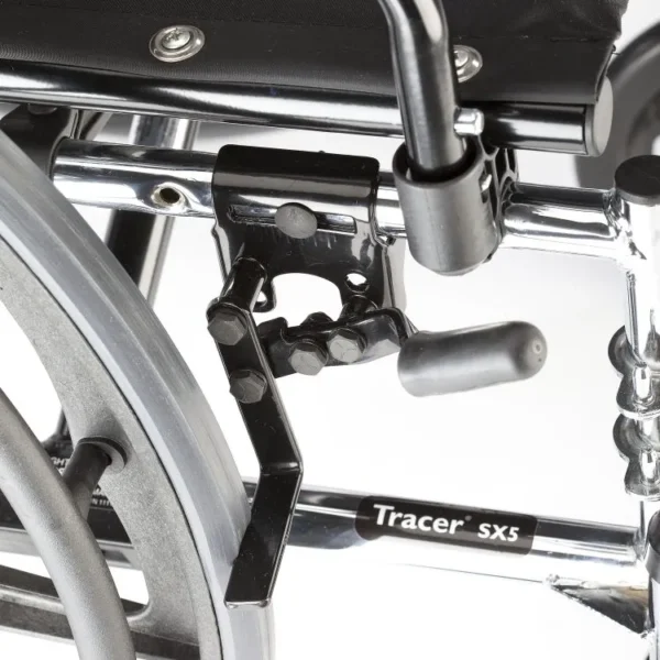 Invacare Tracer SX5 wheelchair with carbon steel frame, padded flip-back armrests, and dual-axle for adjustable hemi-height.
