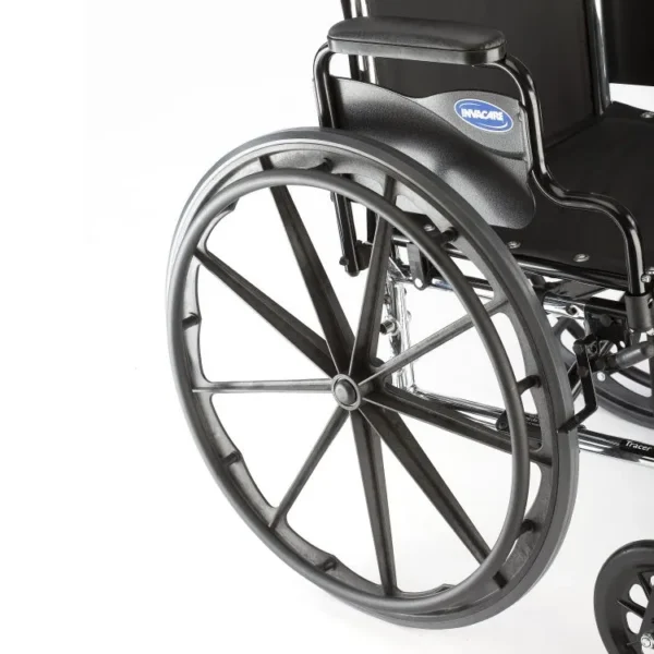 Invacare Tracer SX5 wheelchair with carbon steel frame, padded flip-back armrests, and dual-axle for adjustable hemi-height.