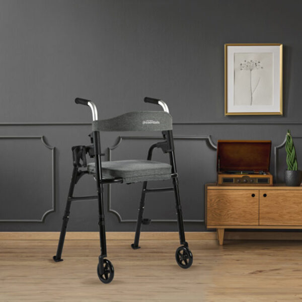 Essentials Walker with padded seat, backrest, 5” wheels, cup holder, and cane holder, designed for portability and convenience.