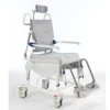 Invacare Aquatec Ocean Ergo Dual VIP shower commode chair with tilt and recline functionality, ergonomic seat, and height-adjustable armrests and footrests.