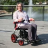 Journey Air Elite Lightweight Folding Power Chair with a carbon fiber frame, brushless motors, foldable design, and joystick control for easy mobility.