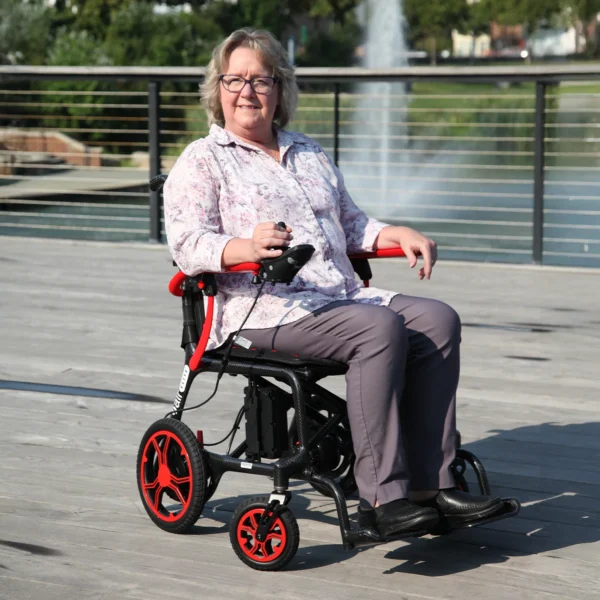 Journey Air Elite Lightweight Folding Power Chair with a carbon fiber frame, brushless motors, foldable design, and joystick control for easy mobility.