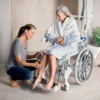 OCEAN ERGO SP 2 Aquatec Ocean Ergo Self-Propel Shower Commode Chair with ergonomic seat, 24-inch wheels, height-adjustable armrests, and included collection pan.