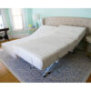 The New Valiant Hospital Bed with head and foot articulation, Trendelenburg adjustability, and optional bamboo rail covers and egress lighting.