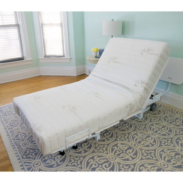 The New Valiant Hospital Bed with head and foot articulation, Trendelenburg adjustability, and optional bamboo rail covers and egress lighting.