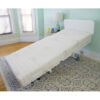 The New Valiant Hospital Bed with head and foot articulation, Trendelenburg adjustability, and optional bamboo rail covers and egress lighting.