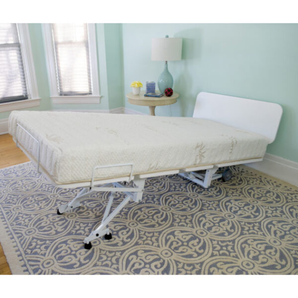 The New Valiant Hospital Bed with head and foot articulation, Trendelenburg adjustability, and optional bamboo rail covers and egress lighting.