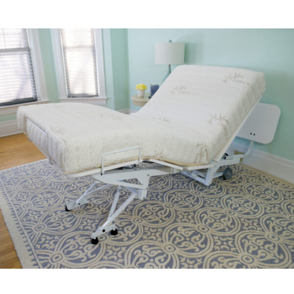 The New Valiant Hospital Bed with head and foot articulation, Trendelenburg adjustability, and optional bamboo rail covers and egress lighting.
