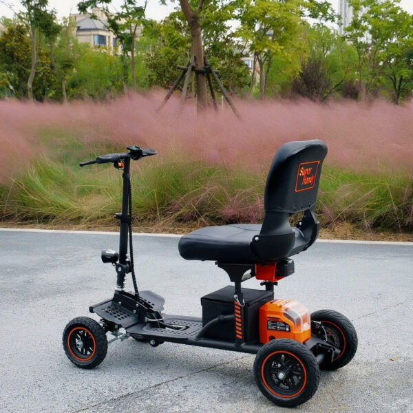 Explorer Mobility Scooter in black and orange, sturdy frame, pneumatic tires, ergonomic handlebars, and control panel for easy operation.
