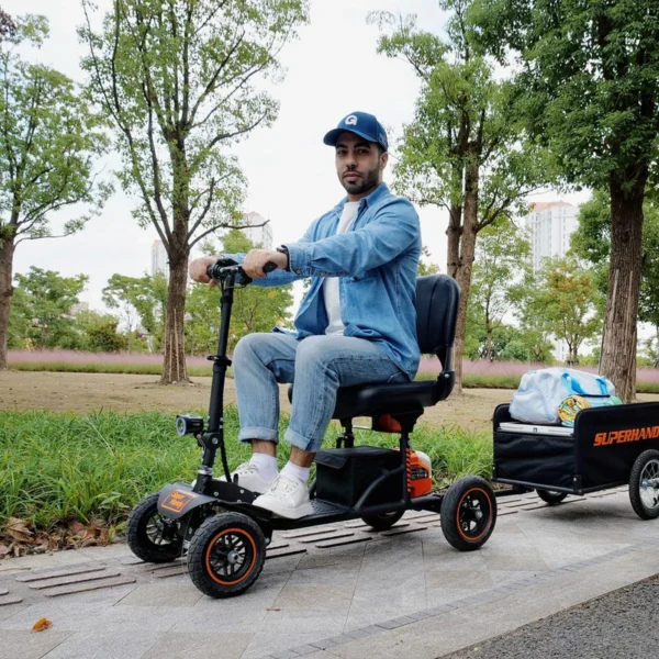 Explorer Mobility Scooter in black and orange, sturdy frame, pneumatic tires, ergonomic handlebars, and control panel for easy operation.