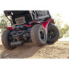 Extreme X8 11 Extreme X8 Power Wheelchair navigating rugged outdoor terrain with knobby tires and a sturdy design, built for sand, snow, and off-road adventures.