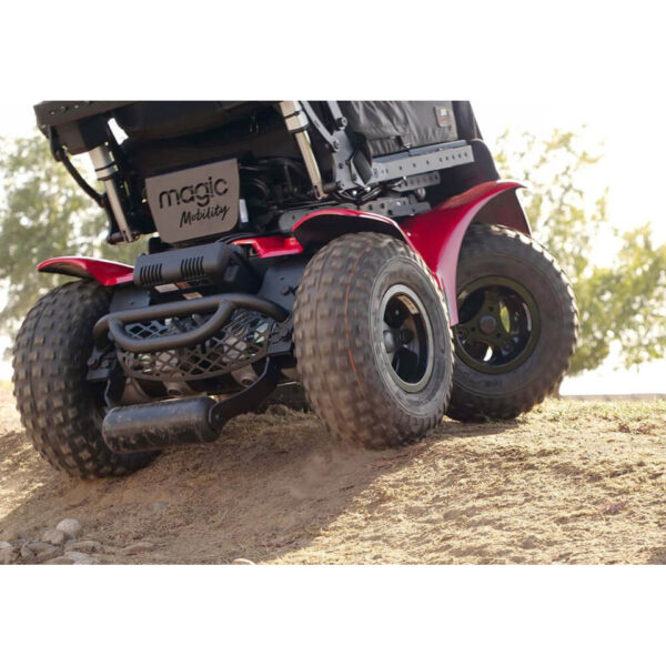 Extreme X8 Power Wheelchair navigating rugged outdoor terrain with knobby tires and a sturdy design, built for sand, snow, and off-road adventures.
