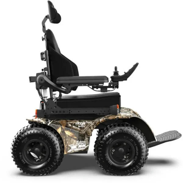 Extreme X8 Power Wheelchair navigating rugged outdoor terrain with knobby tires and a sturdy design, built for sand, snow, and off-road adventures.