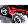 Extreme X8 8 Extreme X8 Power Wheelchair navigating rugged outdoor terrain with knobby tires and a sturdy design, built for sand, snow, and off-road adventures.