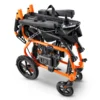GoRide 2 Electric Wheelchair in orange, foldable aluminum frame, padded seat, 12” rear wheels, and ergonomic joystick controls.