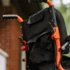 GoRide 2 Electric Wheelchair in orange, foldable aluminum frame, padded seat, 12” rear wheels, and ergonomic joystick controls.