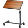 Overbed Table Tilt-Top with adjustable height and tilt, featuring a walnut wood-grained laminate surface and locking swivel wheels.