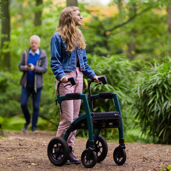 Rollz Motion Performance, an all-terrain rollator and wheelchair combo with air-filled tires, wedge-shaped seat, and reflective accents for outdoor adventures.