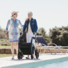 Rollz Motion Performance, an all-terrain rollator and wheelchair combo with air-filled tires, wedge-shaped seat, and reflective accents for outdoor adventures.