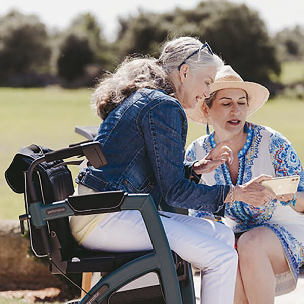 Rollz Motion Performance, an all-terrain rollator and wheelchair combo with air-filled tires, wedge-shaped seat, and reflective accents for outdoor adventures.