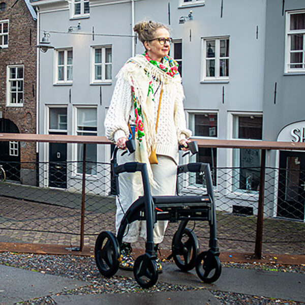 Rollz Motion Rhythm rollator walker with laser line, metronome, and vibration cues, designed for Parkinson’s patients to improve walking rhythm and overcome freezing of gait.