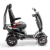 Vita Monster all-terrain mobility scooter in midnight black, featuring 15” rear tires, 900-watt motor, LED lights, and sporty captain's seat for outdoor performance.