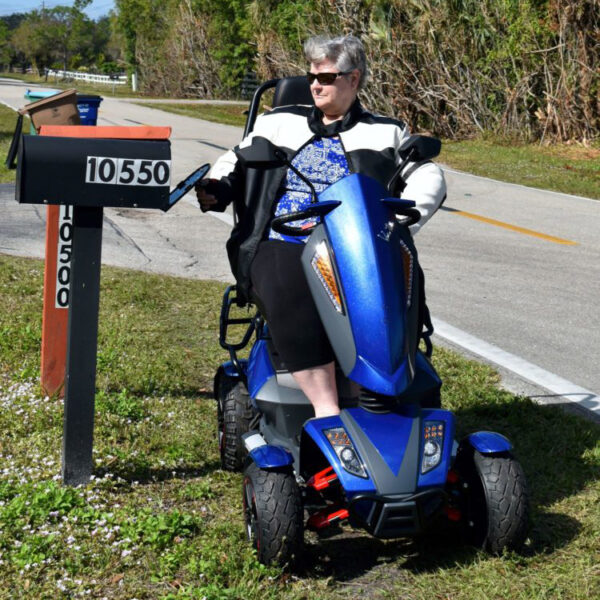 Vita Monster all-terrain mobility scooter in midnight black, featuring 15” rear tires, 900-watt motor, LED lights, and sporty captain's seat for outdoor performance.