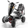 Vita Monster all-terrain mobility scooter in midnight black, featuring 15” rear tires, 900-watt motor, LED lights, and sporty captain's seat for outdoor performance.